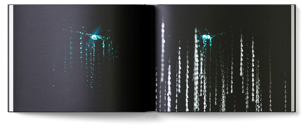Sample double page of the 'New Zealand Karst' book showing glowworms glowing blue