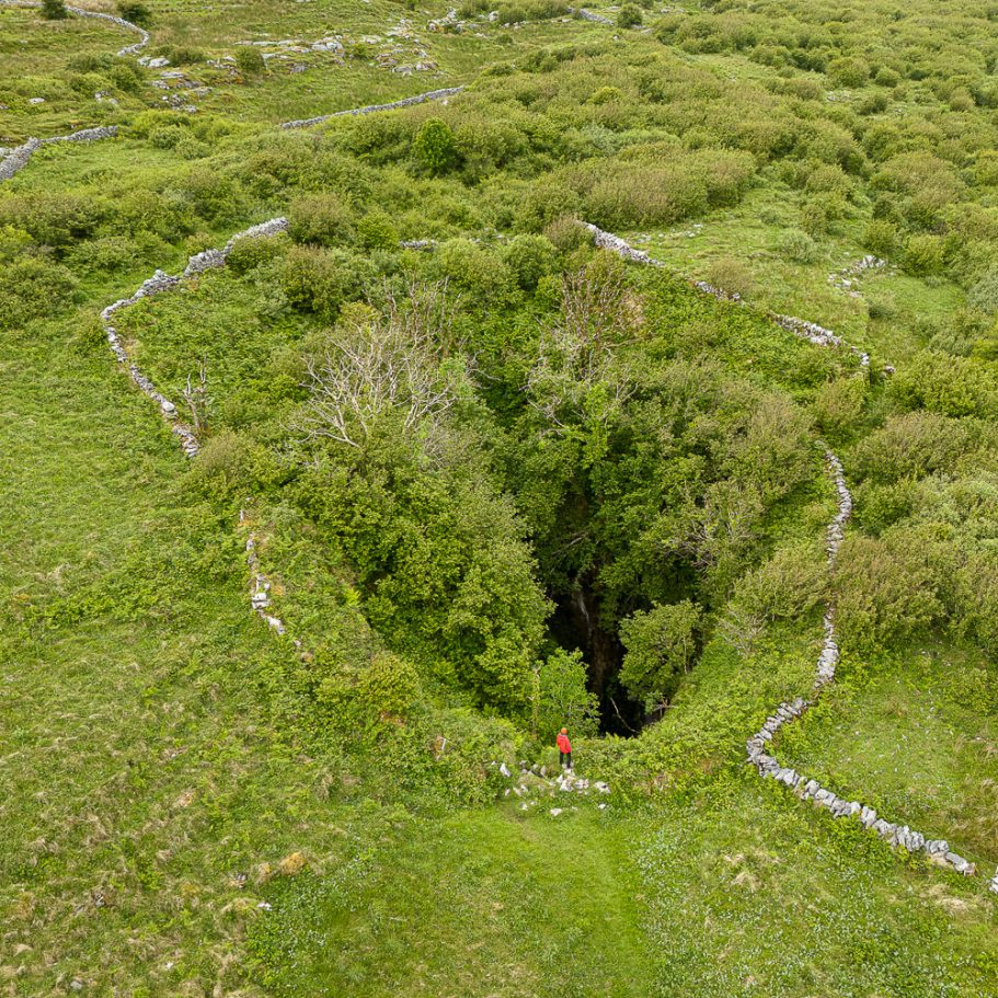 Caver at pothole cave entrance