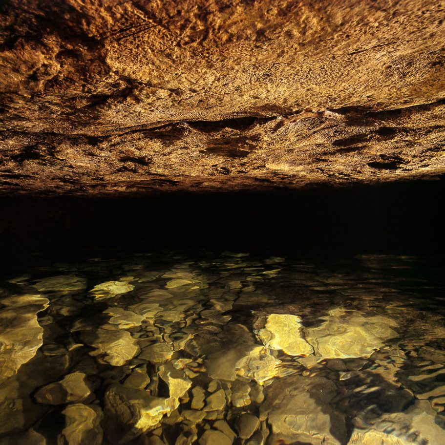 Water and cave ceiling