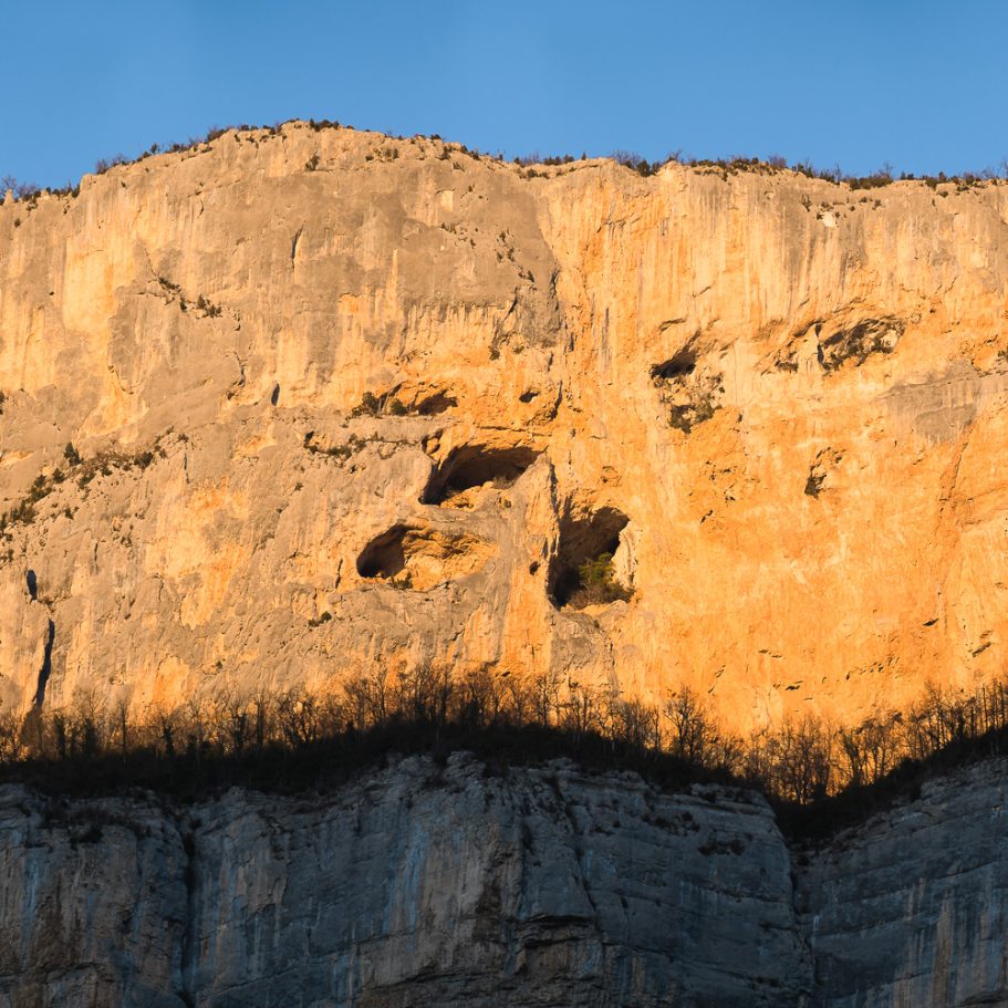 Limestone cliff glowing orange during sunset