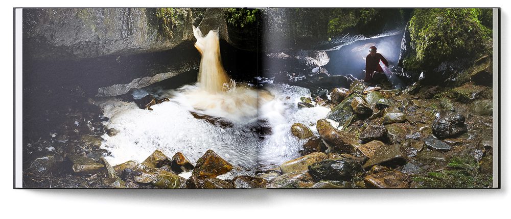 Sample double-page of the 'Burren' book showing a waterfall next to a cave entrance