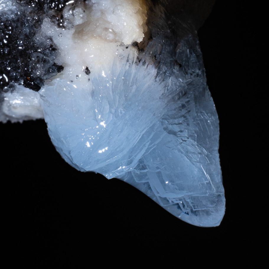 Sky-blue, tabular baryte crystals forming an initial stalactite