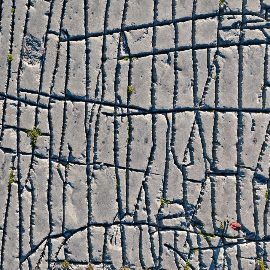 Aerial photo of limestone pavement with person for scale