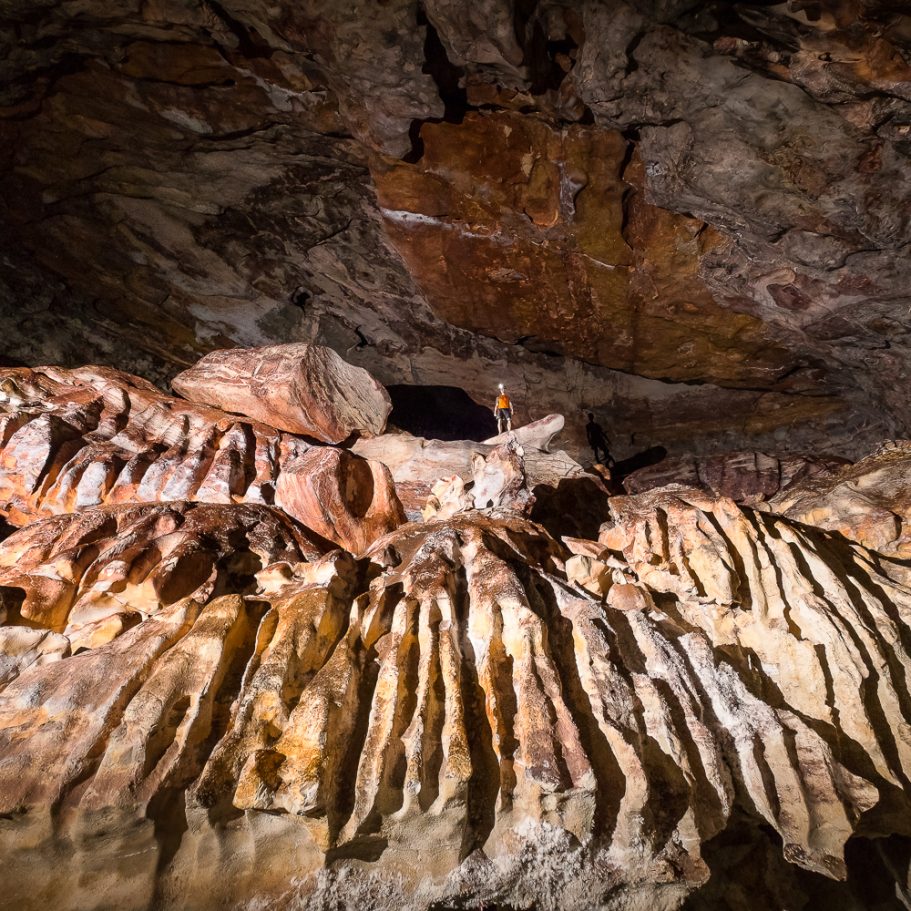 Giant rillenkarren in boulders in a large cave chamber