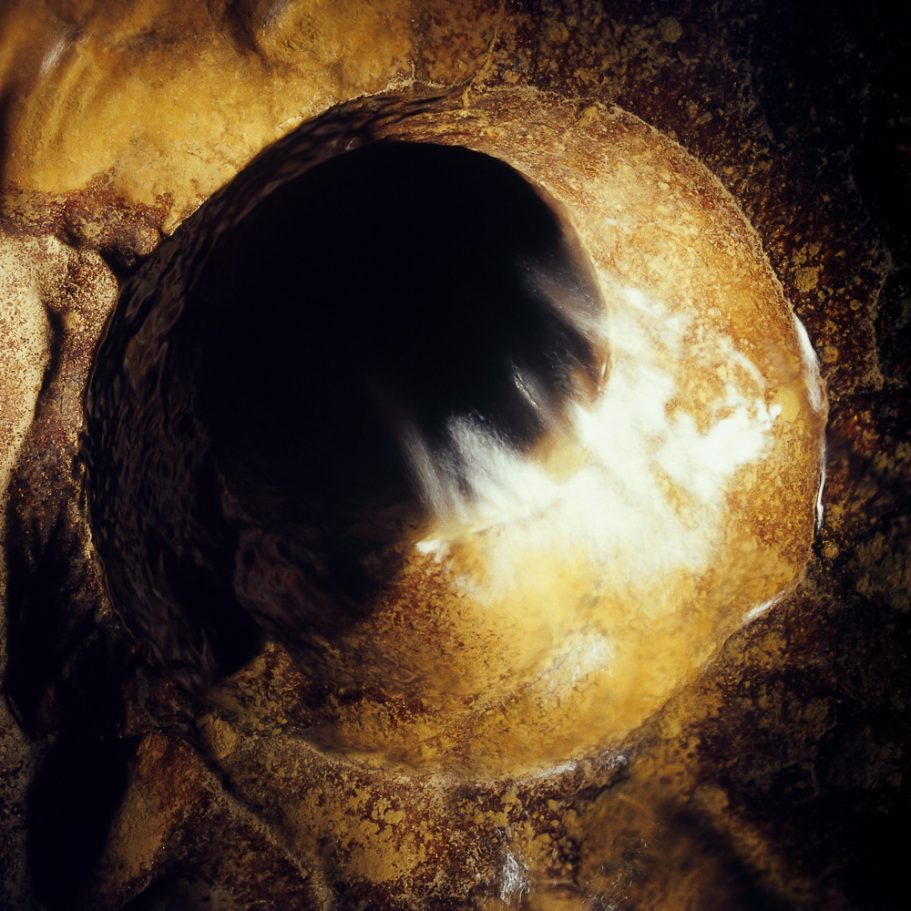 Long-time exposure of water rushing into a cave gour