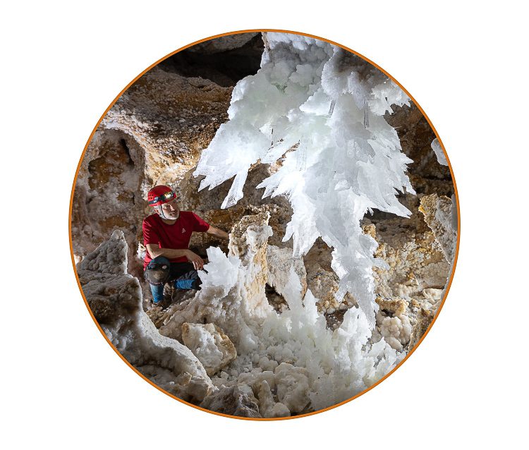 Max Wisshak next to a 2 m long gypsum crystal 'chandelier' in Lechuguilla Cave