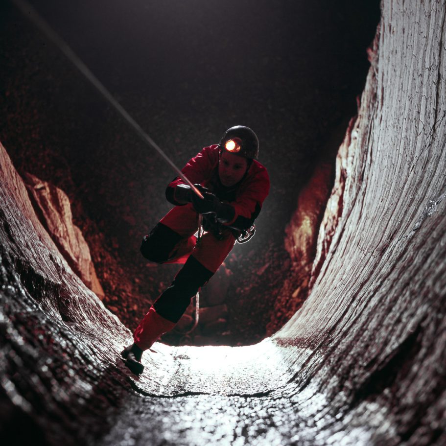 Caver climbing a rope seen from above