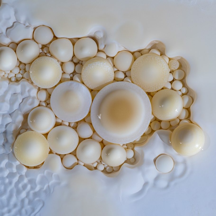 Superb cluster of delicate cave pearls in a shallow cave pool at 'Pearlsian Gulf' in Lechuguilla Cave