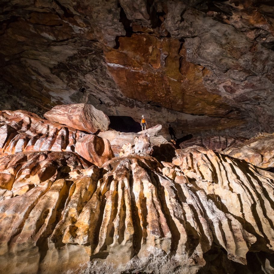 Large solution runnels (rillenkarren) on the limestone floor of a large cave chamber