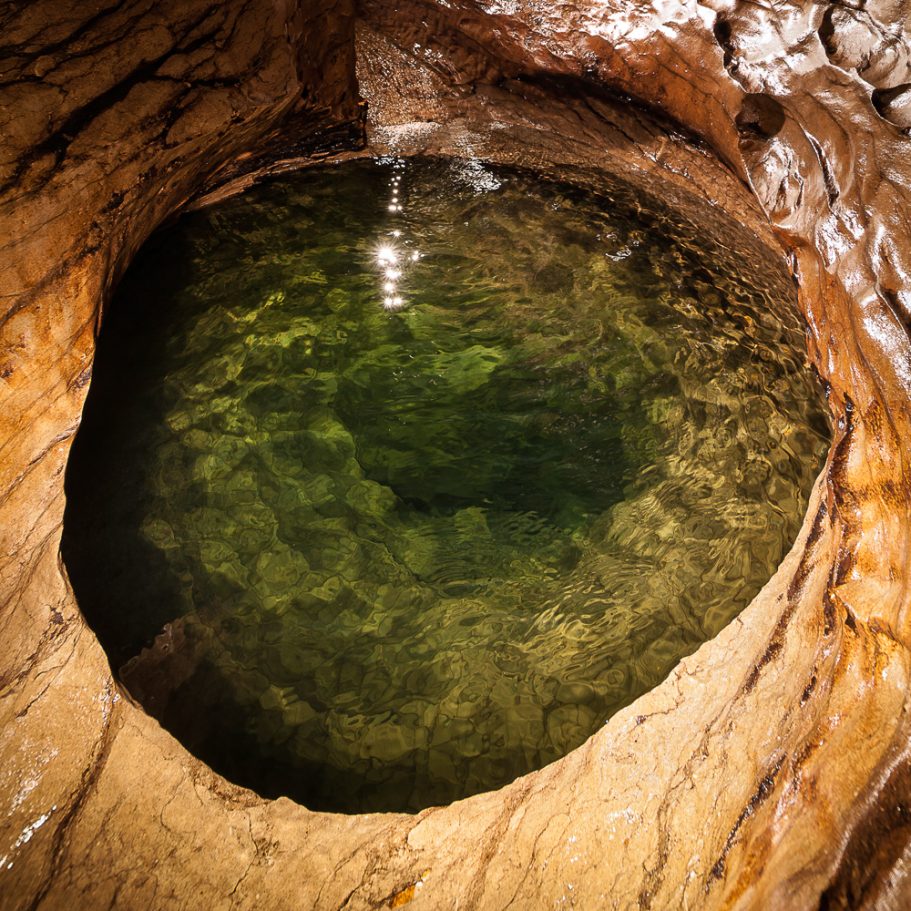 Large circular cave gour filled with water